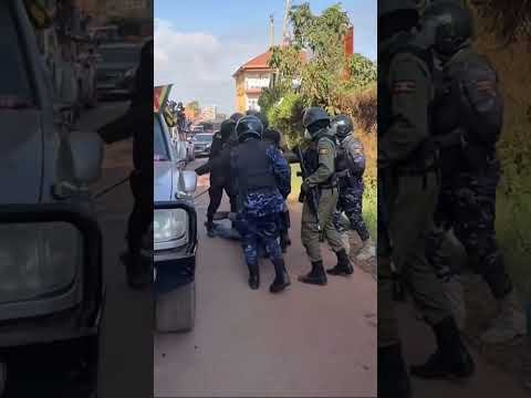 UGANDA POLICE MEN KICK BOBI WINE SUPPORTER LIKE A BALL